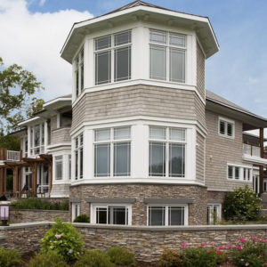 Eldorado stacked stone nantucket facade on bottom portion of home and wall