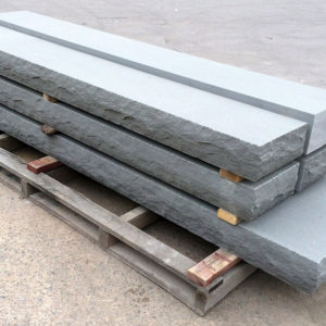 Steps in Thermal Bluestone with rockface edge on a pallet in a stoneyard