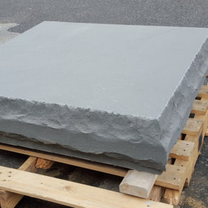 Column cap in Thermal Bluestone with rockface edge on a pallet