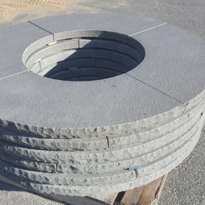 Firepit caps in Thermal Bluestone with rockface edge on a pallet