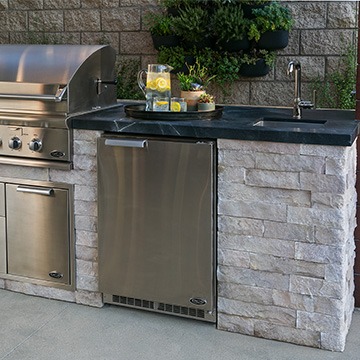 outdoor kitchen built with kindred cabinets