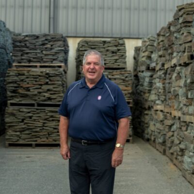 Careers-Stone Portland stone ware employee standing with stone