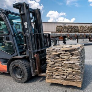 transferring stone on forklift